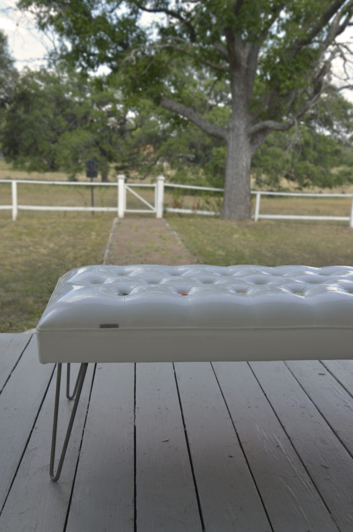The Glow bench with diamond tufting and hairpin legs